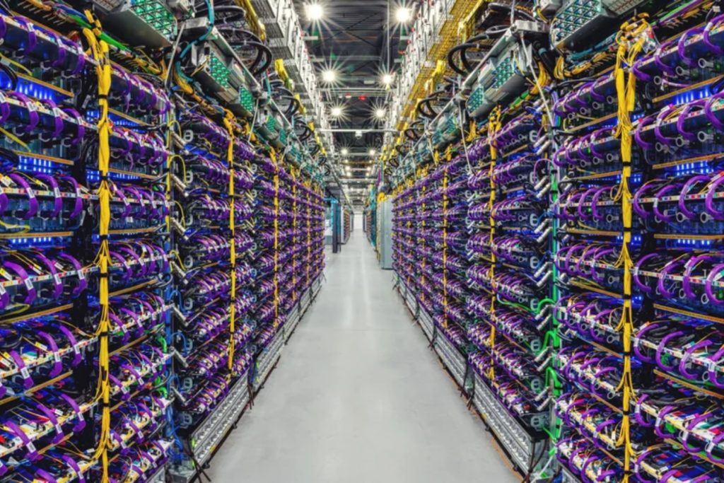 A row of Cloud TPU v5p AI accelerator supercomputers in a Google Gemini data center.